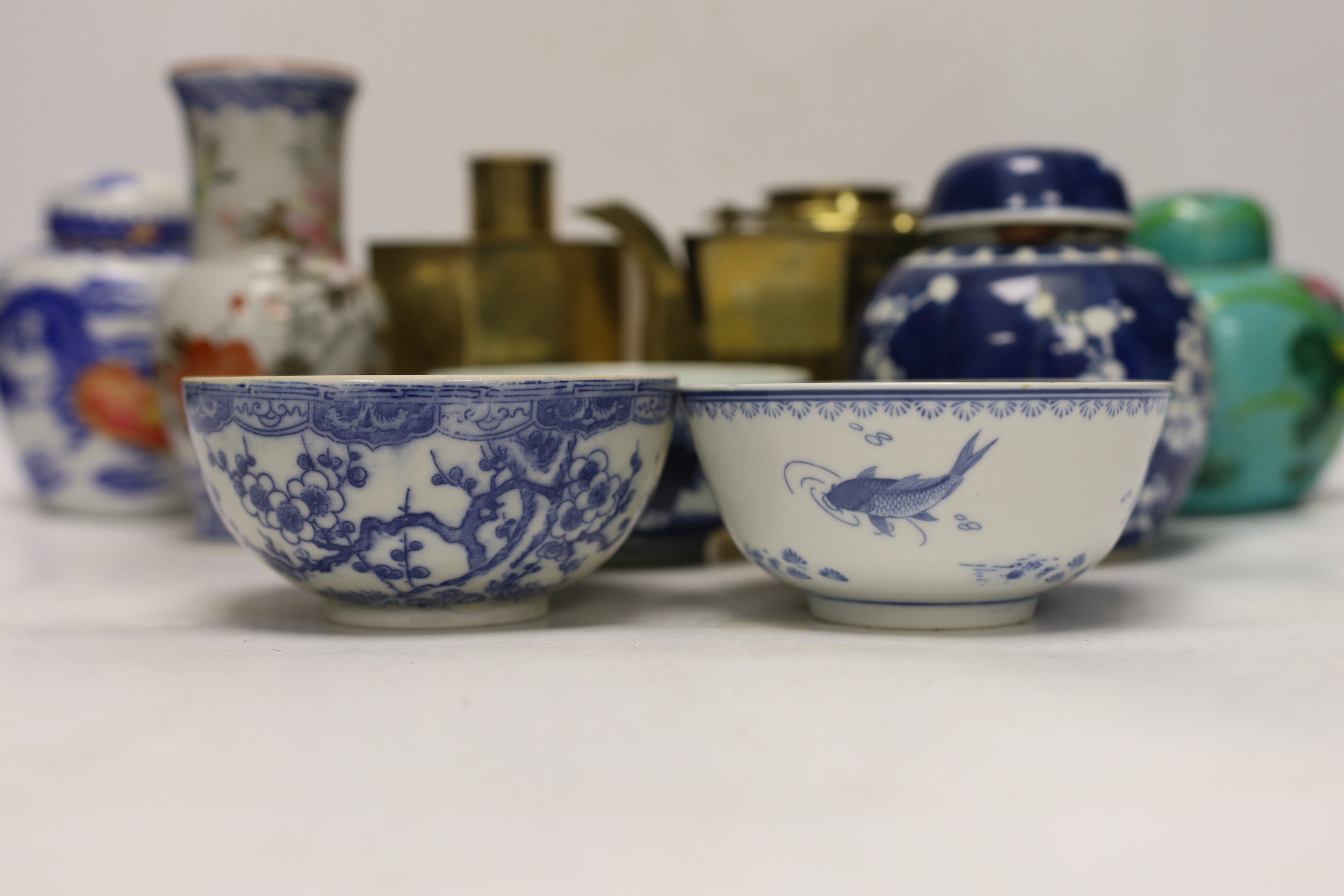 Chinese items including a brass tea caddy and kettle, blue and white porcelain bowls and a Japanese vase